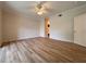 Large bedroom with wood-look floors and access to en-suite bathroom at 4193 Limerick Dr, Lake Wales, FL 33859