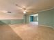 Large bonus room with ceiling fan and neutral carpeting at 4193 Limerick Dr, Lake Wales, FL 33859