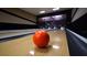 Bowling alley with orange bowling ball on lane at 4193 Limerick Dr, Lake Wales, FL 33859