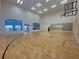 Indoor basketball court with wood flooring, high ceilings and large windows at 4193 Limerick Dr, Lake Wales, FL 33859