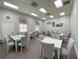 Community room with tables and chairs for gatherings at 4193 Limerick Dr, Lake Wales, FL 33859