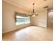 Bright dining room with tile floors, chandelier, and large window at 4193 Limerick Dr, Lake Wales, FL 33859