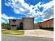 Charming two-story home with a brick driveway and well-manicured lawn at 4193 Limerick Dr, Lake Wales, FL 33859
