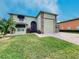 Stunning two-story home with a large garage and attractive landscaping at 4193 Limerick Dr, Lake Wales, FL 33859