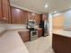 Spacious kitchen with wood cabinets and stainless steel appliances at 4193 Limerick Dr, Lake Wales, FL 33859