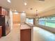 Kitchen with island and view into Gathering room and backyard at 4193 Limerick Dr, Lake Wales, FL 33859