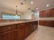 Eat-in kitchen with breakfast bar, island, and ample cabinets at 4193 Limerick Dr, Lake Wales, FL 33859
