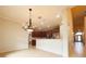 Open kitchen with breakfast bar, stainless steel appliances, and wood cabinets at 4193 Limerick Dr, Lake Wales, FL 33859