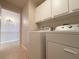 Laundry room with washer, dryer, and cabinets at 4193 Limerick Dr, Lake Wales, FL 33859