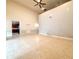 Spacious living room with high ceilings, ceiling fan and tile floors at 4193 Limerick Dr, Lake Wales, FL 33859