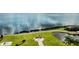 Scenic lakeside memorial with walkway and chessboard at 4193 Limerick Dr, Lake Wales, FL 33859