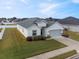 One-story house, gray garage, well-manicured lawn at 425 Riders Loop, Auburndale, FL 33823
