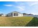 Large backyard with grassy lawn and privacy fence at 425 Riders Loop, Auburndale, FL 33823