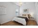 Cozy bedroom with a double bed and wooden headboard at 425 Riders Loop, Auburndale, FL 33823