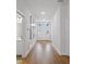 Bright entry with hardwood floors and wall art at 425 Riders Loop, Auburndale, FL 33823
