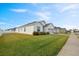Single-story home with a landscaped lawn and attached garage at 425 Riders Loop, Auburndale, FL 33823