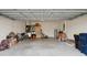 Attached garage with space for cars, storage, and bikes at 425 Riders Loop, Auburndale, FL 33823