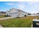 House exterior showcasing a two-car garage and well-manicured lawn at 425 Riders Loop, Auburndale, FL 33823