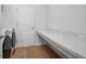 Bright laundry room with washer, dryer, and built-in counter space at 425 Riders Loop, Auburndale, FL 33823
