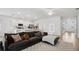 Spacious living room with sectional sofa and large wall art at 425 Riders Loop, Auburndale, FL 33823