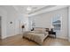 Main bedroom with king-size bed and ceiling fan at 425 Riders Loop, Auburndale, FL 33823