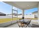 Screened patio with table and chairs, ideal for outdoor dining at 425 Riders Loop, Auburndale, FL 33823