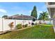 Large backyard with a fenced pool and garden area at 426 Allison Ave, Davenport, FL 33897