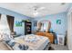 Bright bedroom with a queen bed and built-in shelving at 426 Allison Ave, Davenport, FL 33897