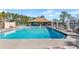 Inviting community pool with a covered patio area at 426 Allison Ave, Davenport, FL 33897