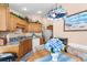 Eat-in kitchen with wood cabinets, granite counters, and a breakfast nook at 426 Allison Ave, Davenport, FL 33897