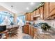 Kitchen features a breakfast nook, ample cabinetry, and a granite countertop at 426 Allison Ave, Davenport, FL 33897