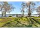 Lake access point with a wooden dock and walkway at 426 Allison Ave, Davenport, FL 33897