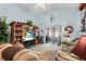 Bright living room with vaulted ceiling, comfy sofas, and access to a sunroom at 426 Allison Ave, Davenport, FL 33897