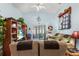 Spacious living room featuring a large TV, comfortable seating, and view of the sunroom at 426 Allison Ave, Davenport, FL 33897