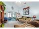Living room with a sectional sofa and access to a sunroom at 426 Allison Ave, Davenport, FL 33897