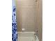 Clean and simple bathroom with a shower and tub at 437 Grand Reserve Dr, Davenport, FL 33837