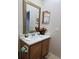 Vanity with a large mirror in a well-lit bathroom at 437 Grand Reserve Dr, Davenport, FL 33837