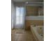 Bathroom with a garden tub and a walk-in shower at 437 Grand Reserve Dr, Davenport, FL 33837