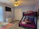 Spacious bedroom with a bunk bed and Frozen theme at 437 Grand Reserve Dr, Davenport, FL 33837