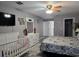Main bedroom with a crib and plenty of space at 437 Grand Reserve Dr, Davenport, FL 33837