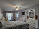 Main bedroom with a crib and sitting area at 437 Grand Reserve Dr, Davenport, FL 33837