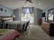 Spacious Primary bedroom with large windows and en-suite bathroom at 437 Grand Reserve Dr, Davenport, FL 33837