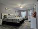 Main bedroom with a crib and sitting area at 437 Grand Reserve Dr, Davenport, FL 33837