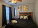 Cozy bedroom featuring a comfortable bed and large window at 437 Grand Reserve Dr, Davenport, FL 33837