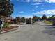 Gated community entrance with brick pillars and landscaping at 437 Grand Reserve Dr, Davenport, FL 33837