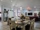 Open concept dining area with kitchen views at 437 Grand Reserve Dr, Davenport, FL 33837