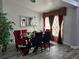 Bright dining room with red chairs and large windows at 437 Grand Reserve Dr, Davenport, FL 33837