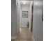 Clean hallway with tile flooring and neutral wall paint at 437 Grand Reserve Dr, Davenport, FL 33837