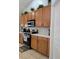 Modern kitchen with ample wood cabinets and countertops at 437 Grand Reserve Dr, Davenport, FL 33837