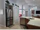 Kitchen boasts stainless steel appliances and an island at 437 Grand Reserve Dr, Davenport, FL 33837